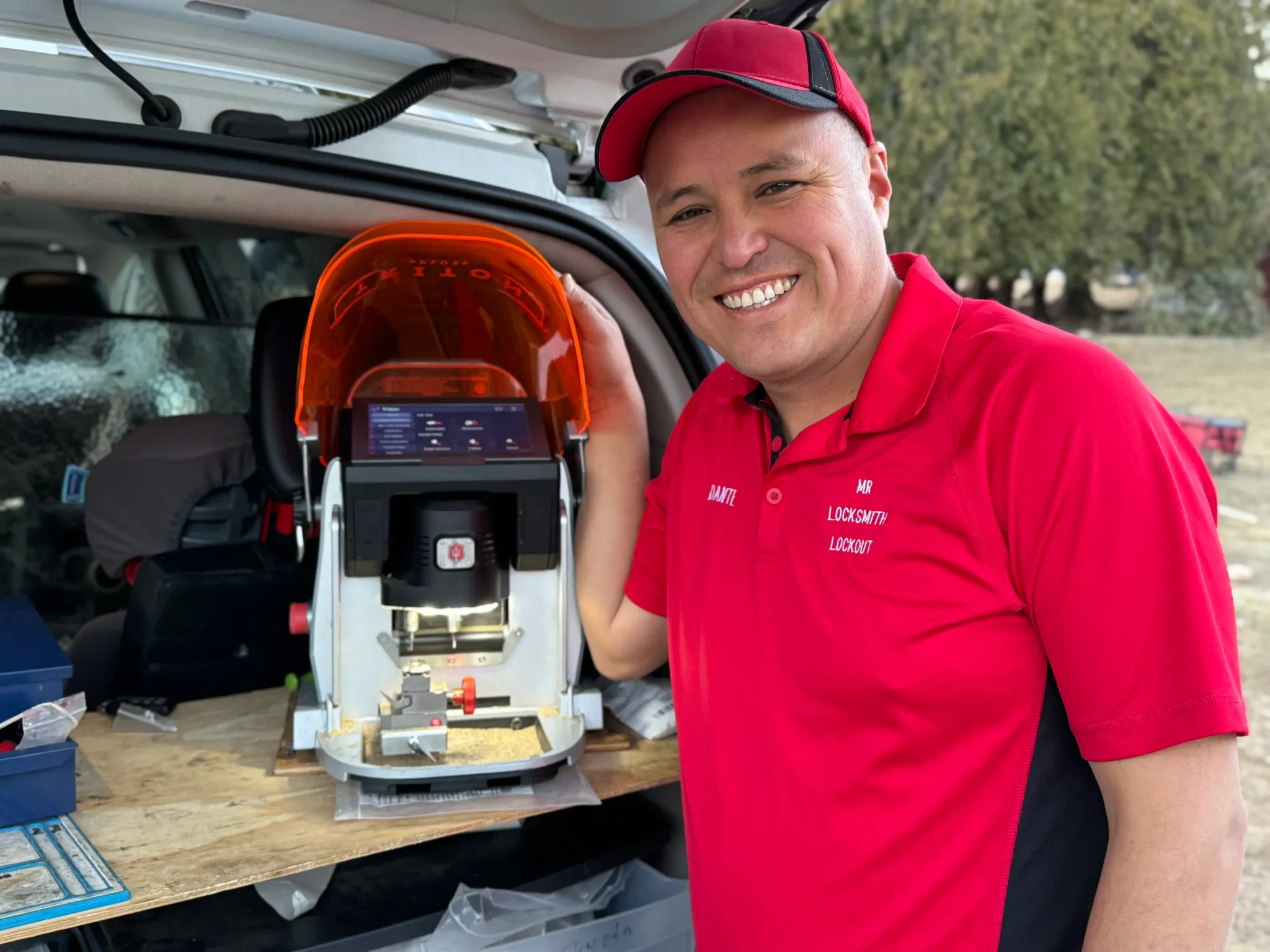 Dante Salcedo using professional key cutting equipment carried in every service van